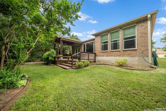 view of front of home with a front lawn and brick siding