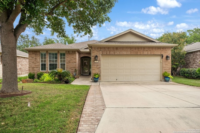 ranch-style house featuring concrete driveway, an attached garage, brick siding, and a front yard