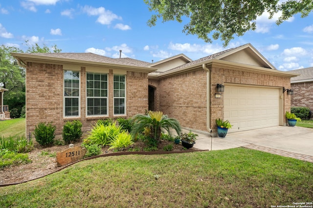 ranch-style home with an attached garage, brick siding, driveway, and a front lawn