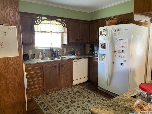 310 Seven Seas, Crosby, TX 77532 - kitchen with decorative backsplash, dark wood-style flooring, a sink, and white appliances