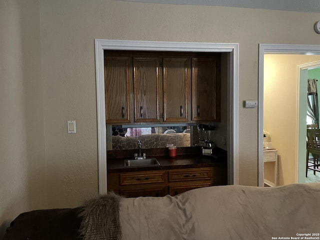 310 Seven Seas, Crosby, TX 77532 - kitchen with dark countertops, tasteful backsplash, and a sink