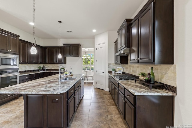 28546 Tristant Rdg, San Antonio, TX 78260 - kitchen featuring backsplash, stainless steel appliances, light stone countertops, and a sink