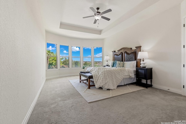 28546 Tristant Rdg, San Antonio, TX 78260 - bedroom featuring carpet flooring, baseboards, a raised ceiling, and ceiling fan