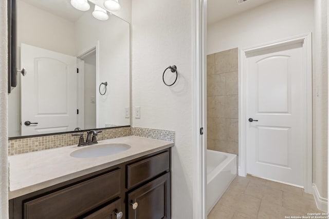 28546 Tristant Rdg, San Antonio, TX 78260 - full bathroom featuring vanity, backsplash, and tile patterned floors