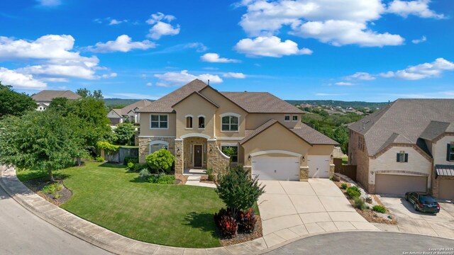 28546 Tristant Rdg, San Antonio, TX 78260 - traditional-style home featuring stone siding, an attached garage, stucco siding, concrete driveway, and a front lawn