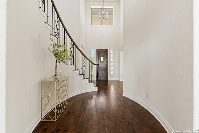 28546 Tristant Rdg, San Antonio, TX 78260 - foyer entrance featuring baseboards, dark wood finished floors, a chandelier, stairway, and a high ceiling