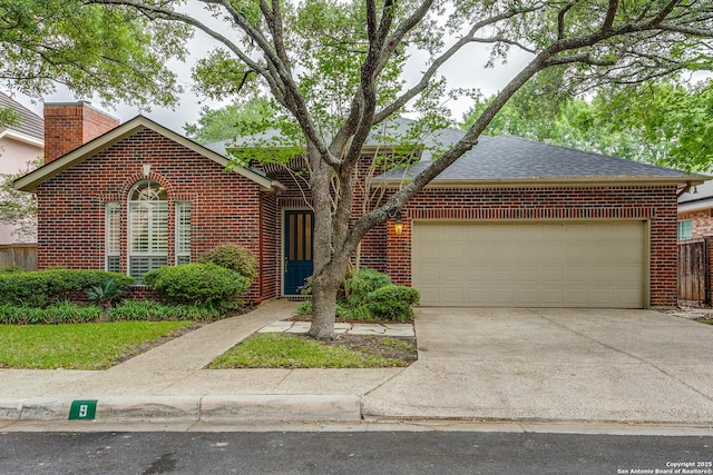 9 Waldenshire, San Antonio, TX 78209 - view of front facade featuring brick siding, concrete driveway, a garage, a chimney, and a shingled roof