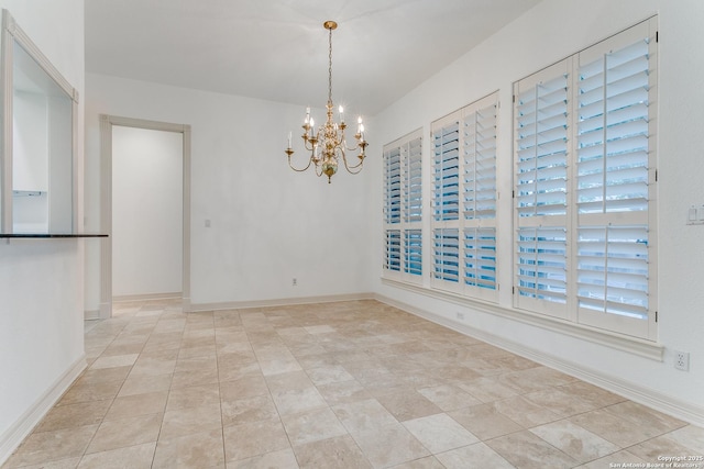 9 Waldenshire, San Antonio, TX 78209 - unfurnished dining area with a chandelier, baseboards, and light tile patterned flooring