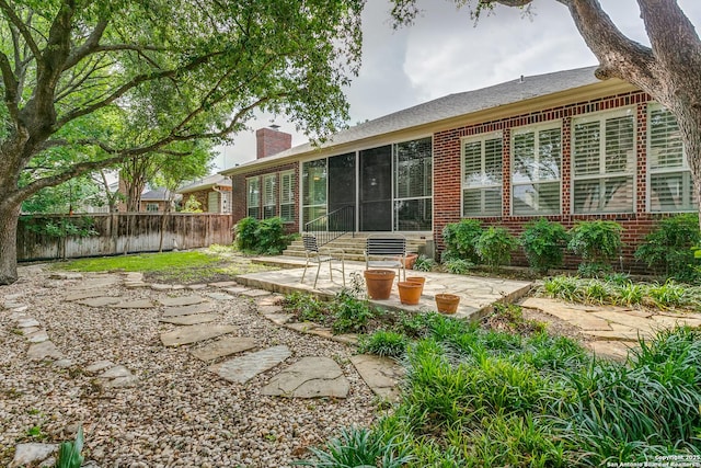 9 Waldenshire, San Antonio, TX 78209 - rear view of property with fence, a patio, a sunroom, and brick siding