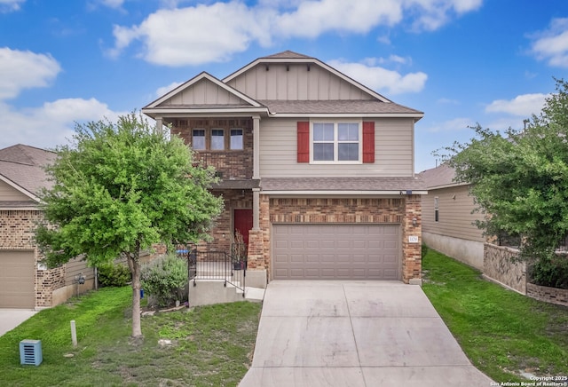 craftsman-style home with a balcony, board and batten siding, a garage, concrete driveway, and a front yard