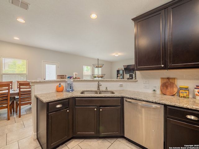 kitchen featuring dishwasher, visible vents, a healthy amount of sunlight, and a sink