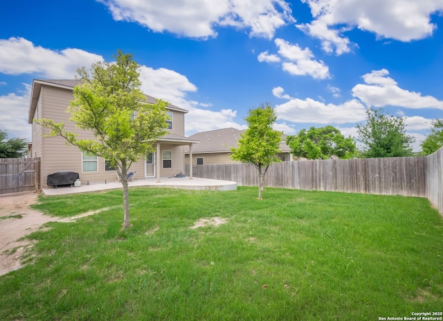 view of yard with a patio area and a fenced backyard