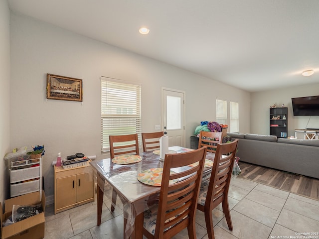 dining room featuring light tile patterned floors, a wealth of natural light, and recessed lighting