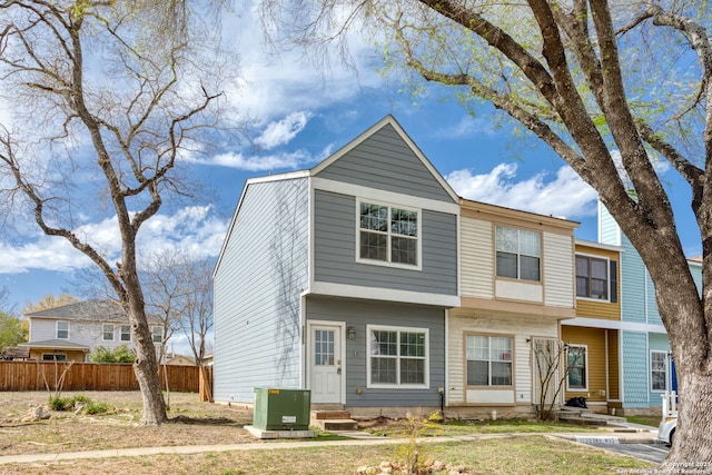 view of front of home featuring entry steps and fence