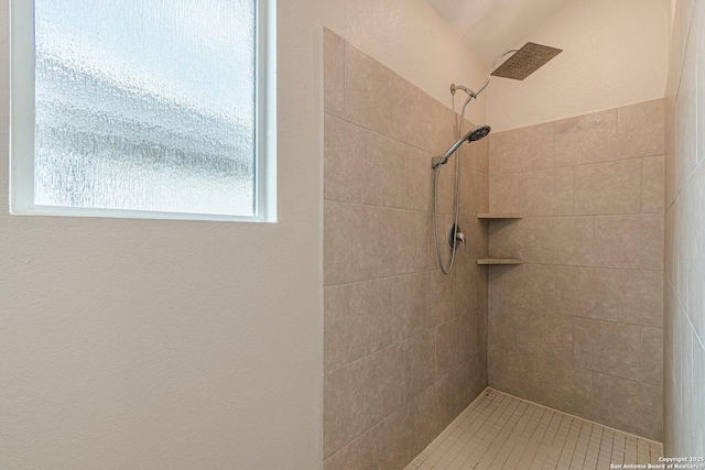 full bathroom featuring a tile shower