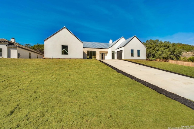 115 Heartland, Boerne, TX 78006 - modern farmhouse style home featuring a garage, a chimney, metal roof, a front yard, and driveway