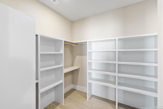 115 Heartland, Boerne, TX 78006 - walk in closet featuring visible vents and light wood-style floors