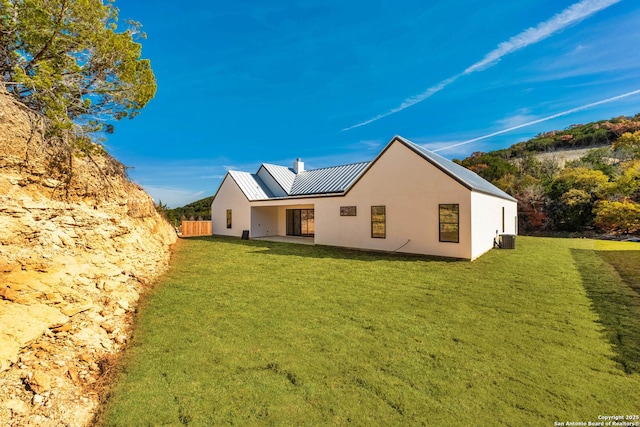 115 Heartland, Boerne, TX 78006 - back of property featuring a yard, stucco siding, metal roof, and a standing seam roof