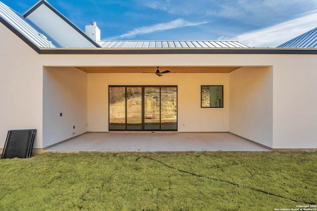 115 Heartland, Boerne, TX 78006 - back of property with a patio area, stucco siding, metal roof, a ceiling fan, and a lawn
