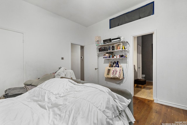bedroom with wood finished floors