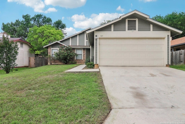 view of front of property featuring an attached garage, fence, concrete driveway, a front yard, and brick siding