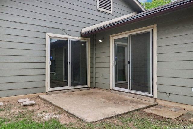 property entrance with a patio area