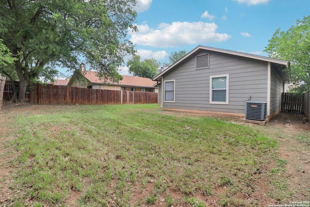 view of yard featuring cooling unit and a fenced backyard