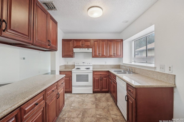 kitchen featuring a textured ceiling, under cabinet range hood, white appliances, visible vents, and a sink
