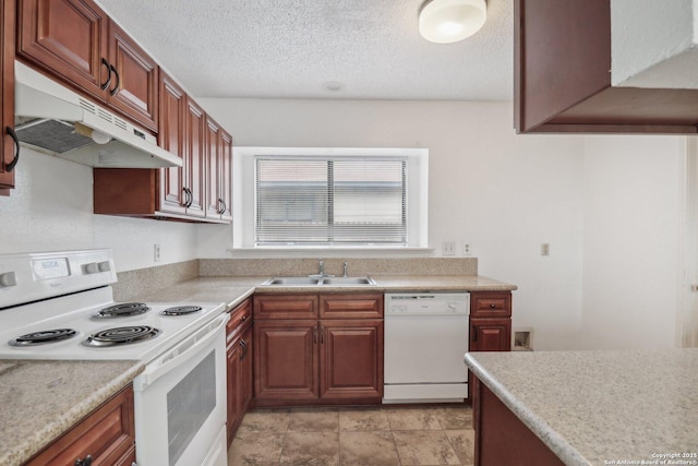 kitchen with a sink, a textured ceiling, white appliances, under cabinet range hood, and light countertops