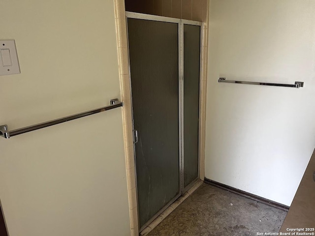 bathroom with a shower stall