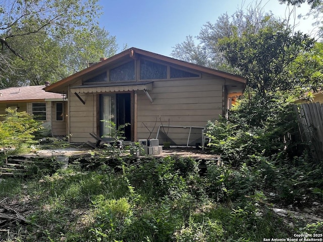 rear view of property with fence