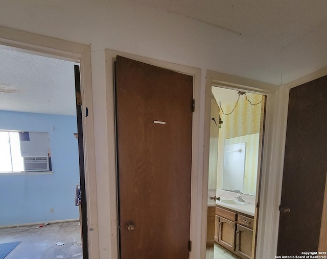 hall featuring a sink