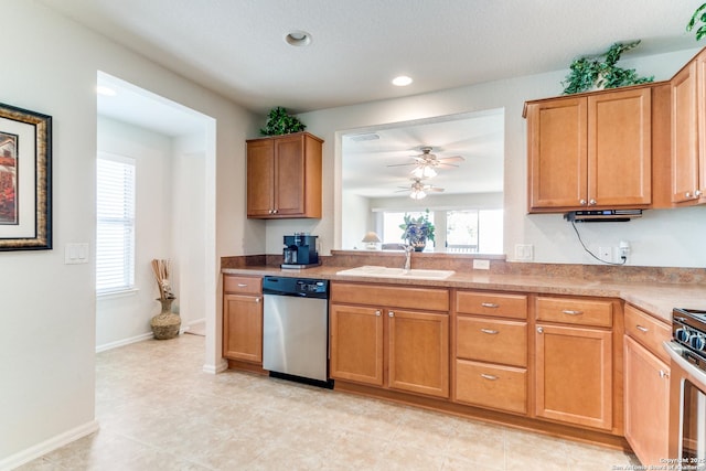 kitchen with appliances with stainless steel finishes, a sink, healthy amount of natural light, a ceiling fan, and recessed lighting