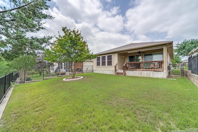 rear view of house with ceiling fan