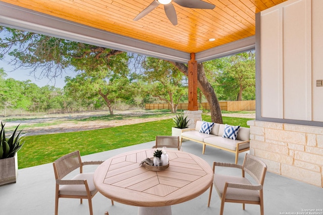 view of patio with ceiling fan, fence, and an outdoor hangout area