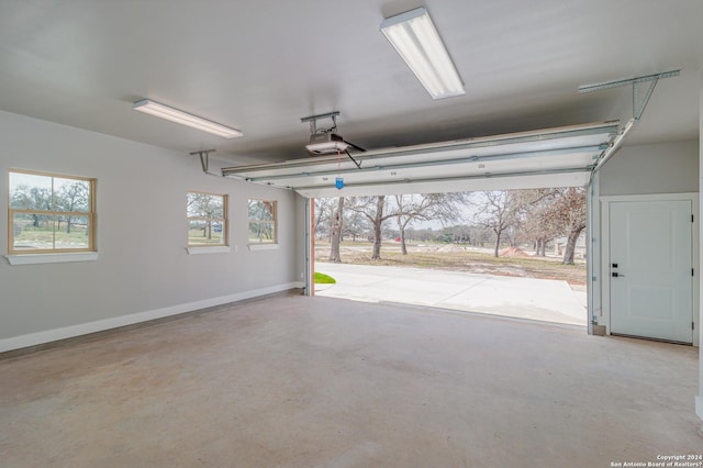 garage featuring baseboards and a garage door opener