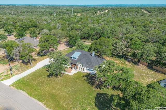 drone / aerial view with a view of trees