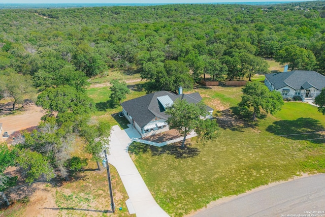 aerial view featuring a view of trees