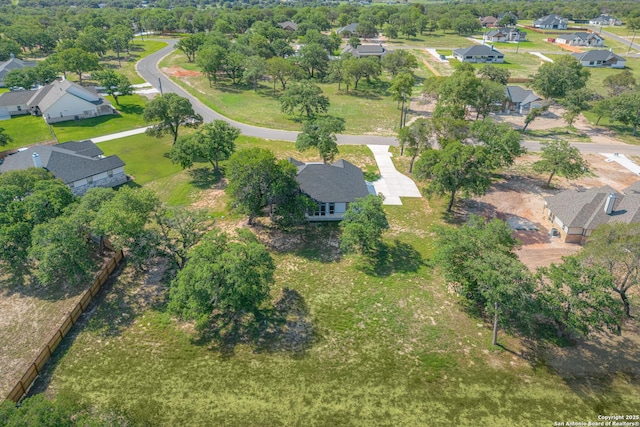 birds eye view of property with a residential view