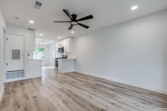 unfurnished living room with visible vents, recessed lighting, ceiling fan, baseboards, and light wood-style floors