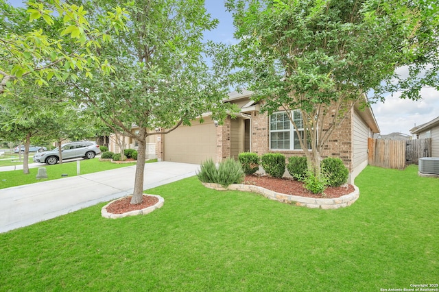 obstructed view of property featuring an attached garage, central AC, fence, brick siding, and driveway