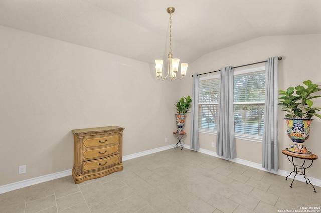 empty room with a chandelier, vaulted ceiling, and baseboards