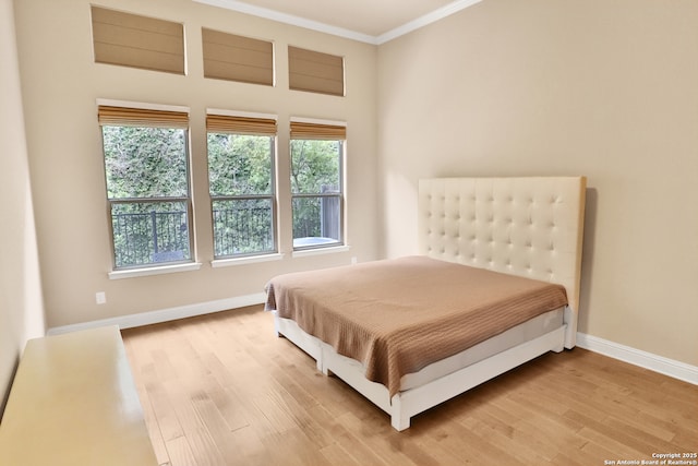 8250 Cruiseship Bay Unit, San Antonio, TX 78255 - bedroom featuring crown molding, light wood-style floors, and baseboards