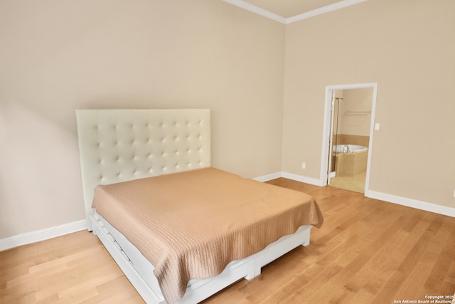 8250 Cruiseship Bay Unit, San Antonio, TX 78255 - bedroom with ornamental molding, connected bathroom, baseboards, and light wood-style floors