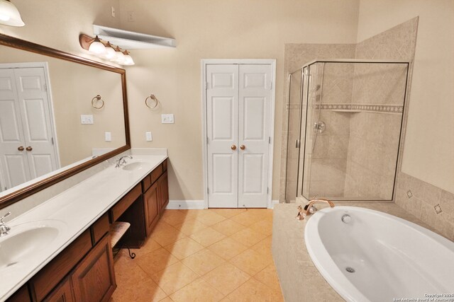 8250 Cruiseship Bay Unit, San Antonio, TX 78255 - bathroom featuring a sink, a closet, a stall shower, double vanity, and a garden tub
