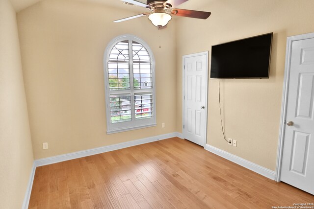 8250 Cruiseship Bay Unit, San Antonio, TX 78255 - unfurnished bedroom with baseboards, light wood-style flooring, and ceiling fan