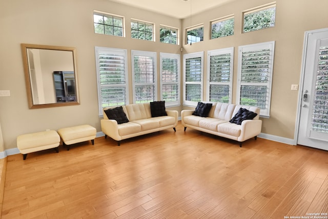 8250 Cruiseship Bay Unit, San Antonio, TX 78255 - living room featuring a wealth of natural light, wood finished floors, and baseboards