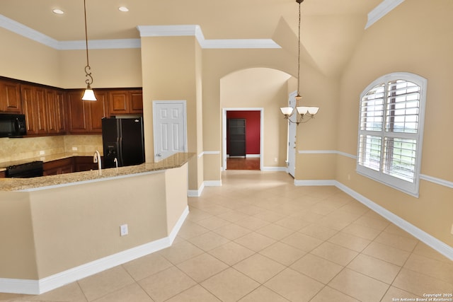 8250 Cruiseship Bay Unit, San Antonio, TX 78255 - kitchen with a towering ceiling, light stone counters, black appliances, decorative backsplash, and light tile patterned floors