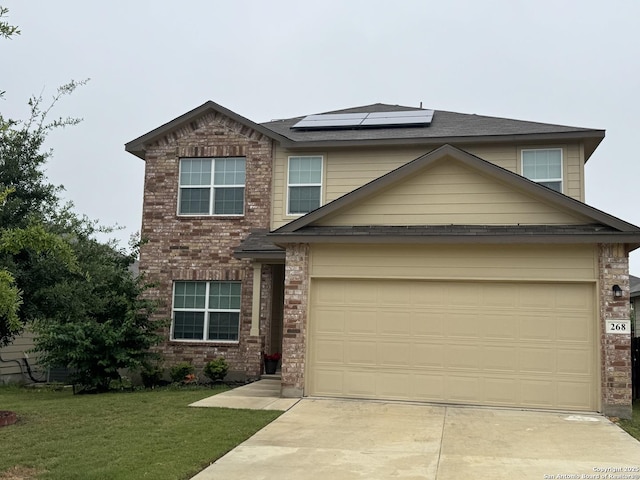 268 Cuban Emerald, San Antonio, TX 78253 - view of front of property featuring concrete driveway, roof mounted solar panels, brick siding, and a front lawn