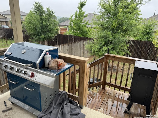 268 Cuban Emerald, San Antonio, TX 78253 - wooden deck with area for grilling and a fenced backyard